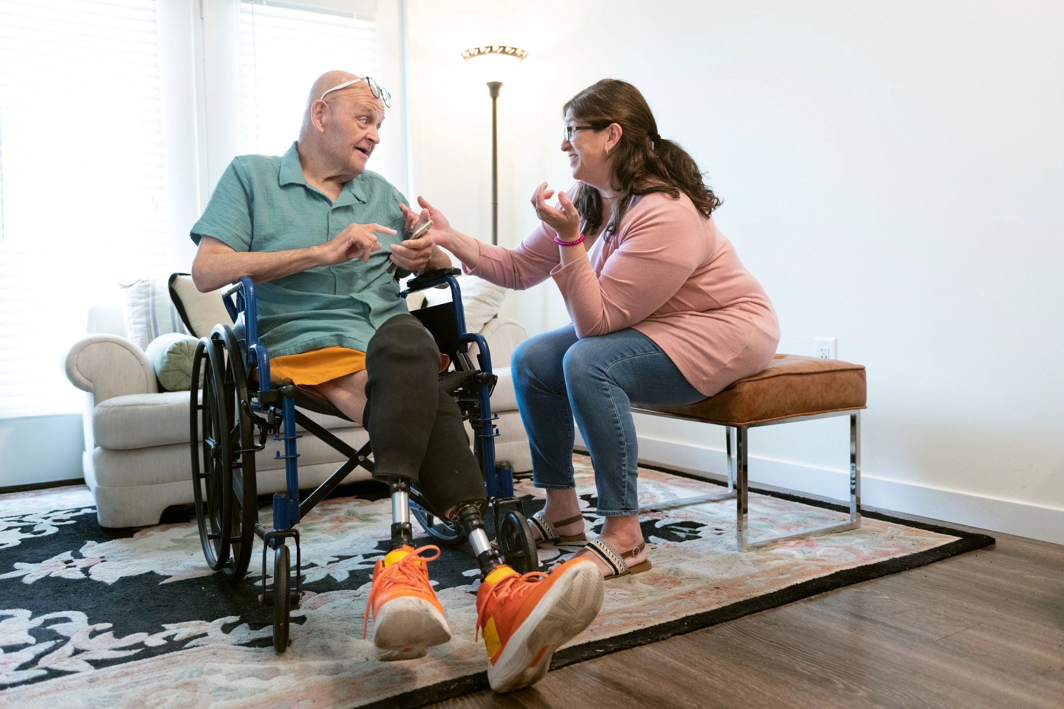 A supportive staff member assisting a resident with daily activities